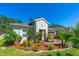 Charming single-story home featuring a well-manicured lawn, mature landscaping, and a welcoming entrance at 5635 Estero Loop, Port Orange, FL 32128