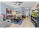 Inviting living room with tile floors, comfortable seating, and stylish decor, bathed in natural light at 5635 Estero Loop, Port Orange, FL 32128