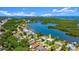 Stunning aerial view of the waterfront property with access to the bay and nearby city at 5809 Riverside Dr, Port Orange, FL 32127