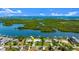 Aerial shot showcasing the waterfront property, surrounding landscape, and community at 5809 Riverside Dr, Port Orange, FL 32127