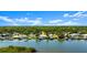 Aerial view of waterfront home with private dock on canal, offering easy access to the Gulf of Mexico at 5809 Riverside Dr, Port Orange, FL 32127