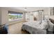 Bright bedroom with a sliding barn door, wood floors and a view to the outside at 5809 Riverside Dr, Port Orange, FL 32127