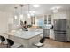 Bright kitchen featuring stainless steel appliances, a marble island and pendant lighting at 5809 Riverside Dr, Port Orange, FL 32127