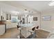 Well-lit kitchen with stainless appliances, central island with seating, open concept design at 5809 Riverside Dr, Port Orange, FL 32127