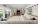 Spacious living room with a large sectional sofa, decorative pillows, and sliding glass doors to an outdoor patio at 5809 Riverside Dr, Port Orange, FL 32127