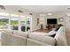 Spacious living room with an outdoor view, comfortable seating, and modern decor for a cozy retreat at 5809 Riverside Dr, Port Orange, FL 32127