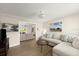Bright living room with modern furniture, stylish decor, and access to the outdoor patio at 5809 Riverside Dr, Port Orange, FL 32127