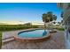 Inviting backyard pool and spa area with lush landscaping and ample patio space for relaxation at 5809 Riverside Dr, Port Orange, FL 32127