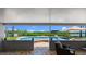 Inviting backyard featuring an in-ground pool, outdoor seating, and scenic waterfront views at 5809 Riverside Dr, Port Orange, FL 32127