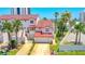 Exterior of a multi-story townhouse featuring a red roof, a driveway, and a garage at 200 Florida Shores Blvd, Daytona Beach, FL 32118