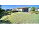 Spacious backyard featuring a screen lanai, perfect for outdoor entertaining and relaxation at 324 Coral Reef Way, Daytona Beach, FL 32124