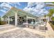 Beautiful open-air clubhouse patio with outdoor seating, bar, and string lights for a relaxing and social atmosphere at 324 Coral Reef Way, Daytona Beach, FL 32124