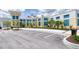 Well-maintained community fitness center featuring ample parking and lush landscaping for an active lifestyle at 324 Coral Reef Way, Daytona Beach, FL 32124
