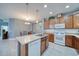 Kitchen island with sink, breakfast bar, and stainless steel appliances including dishwasher at 324 Coral Reef Way, Daytona Beach, FL 32124