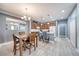 Eat-in kitchen featuring an island with counter seating, updated appliances, and wooden cabinets at 324 Coral Reef Way, Daytona Beach, FL 32124