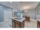 Spacious kitchen with wood cabinets, modern appliances, and an island with a sink at 324 Coral Reef Way, Daytona Beach, FL 32124