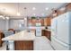 Bright kitchen with stainless steel sink, modern appliances, and a white tiled backsplash at 324 Coral Reef Way, Daytona Beach, FL 32124