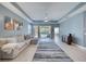 Spacious living room with tile floors, modern furniture, and a sliding glass door to outdoor patio at 324 Coral Reef Way, Daytona Beach, FL 32124