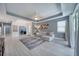 Open-concept living room features wood floors, ceiling fan, and a comfortable sectional sofa at 324 Coral Reef Way, Daytona Beach, FL 32124