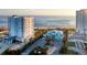Beautiful oceanfront buildings surrounded by lush landscaping, providing a serene coastal living experience at 324 Coral Reef Way, Daytona Beach, FL 32124