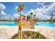 Directional sign post points the way at this resort style pool and amenity center in Watersound, FL at 324 Coral Reef Way, Daytona Beach, FL 32124