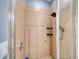 Close up of the modern, glass enclosed tile shower at 324 Coral Reef Way, Daytona Beach, FL 32124