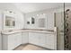 Bright bathroom with granite countertop and dual sinks, plus a sleek glass-enclosed shower at 530 Estates Pl, Longwood, FL 32779