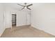Clean and bright bedroom features neutral carpet, fan, and closet at 530 Estates Pl, Longwood, FL 32779