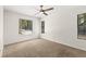 Bedroom features plush neutral carpet, a ceiling fan, and bright natural light at 530 Estates Pl, Longwood, FL 32779