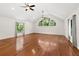Spacious bonus room with vaulted ceilings, hardwood floors, and multiple windows at 530 Estates Pl, Longwood, FL 32779
