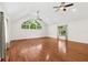 Bonus room features high ceilings, hardwood floors, and unique modern windows at 530 Estates Pl, Longwood, FL 32779