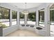 Bright dining nook with pool views and a custom window seat at 530 Estates Pl, Longwood, FL 32779