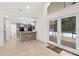 Open kitchen featuring tiled floors, modern appliances, grey cabinetry and a breakfast bar perfect for entertaining at 530 Estates Pl, Longwood, FL 32779