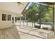 Enclosed lanai showcasing a pool, patio, ceiling fan, and palm trees at 530 Estates Pl, Longwood, FL 32779