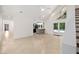 Open-concept living space featuring tile flooring with kitchen view and a glass door leading to the outside at 530 Estates Pl, Longwood, FL 32779