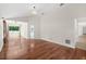 Expansive living room boasts hardwood flooring, vaulted ceilings, and access to the outdoor spaces at 530 Estates Pl, Longwood, FL 32779