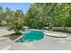 Backyard pool and landscaping offer a private retreat, perfect for relaxation and entertaining at 530 Estates Pl, Longwood, FL 32779