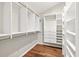 Large walk-in closet with custom shelving and drawers, offering ample storage space at 530 Estates Pl, Longwood, FL 32779