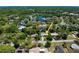 Expansive aerial view of the community highlighting the property, pool, and surrounding landscape at 75 Knollwood Estates Dr, Ormond Beach, FL 32174