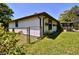 Spacious backyard with a fenced perimeter, a screened-in lanai and mature landscaping at 75 Knollwood Estates Dr, Ormond Beach, FL 32174