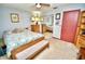 Cozy bedroom features a mirrored closet, ceiling fan, and natural light at 75 Knollwood Estates Dr, Ormond Beach, FL 32174