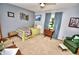 Charming bedroom featuring neutral walls, cozy carpeting and a decorative gallery wall at 75 Knollwood Estates Dr, Ormond Beach, FL 32174