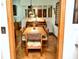 Warm dining room with hardwood floors and a view into the living area at 75 Knollwood Estates Dr, Ormond Beach, FL 32174