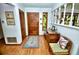 Inviting entryway with wood floors, a decorative door, and lots of natural light at 75 Knollwood Estates Dr, Ormond Beach, FL 32174