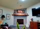 Close up of the fireplace, which is made of grey brick and features a decorative hearth at 75 Knollwood Estates Dr, Ormond Beach, FL 32174