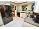 Modern kitchen has stainless steel appliances, tile floors, and white cabinets at 75 Knollwood Estates Dr, Ormond Beach, FL 32174