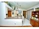 Bright and airy kitchen featuring pendant lighting, tiled floors and breakfast bar at 75 Knollwood Estates Dr, Ormond Beach, FL 32174