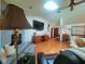 Bright living room boasts a fireplace, hardwood floors, and skylight at 75 Knollwood Estates Dr, Ormond Beach, FL 32174