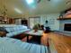 Bright living room with vaulted ceilings, fireplace, comfortable seating, and plenty of natural light at 75 Knollwood Estates Dr, Ormond Beach, FL 32174