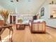 Spacious living room with beautiful wood floors, comfortable furniture, and lots of natural light at 75 Knollwood Estates Dr, Ormond Beach, FL 32174